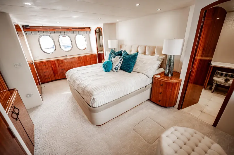 Slide: The Image of Luxurious bedroom interior of 2012 Hatteras 80 Motor Yacht with elegant wood finishes. - 106