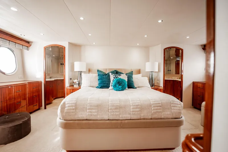 Slide: The Image of Luxurious bedroom interior of 2012 Hatteras 80 Motor Yacht with elegant decor and plush bedding. - 107