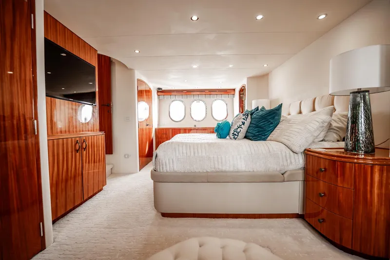 Slide: The Image of Luxurious bedroom interior of 2012 Hatteras 80 Motor Yacht with elegant wood finishes. - 109