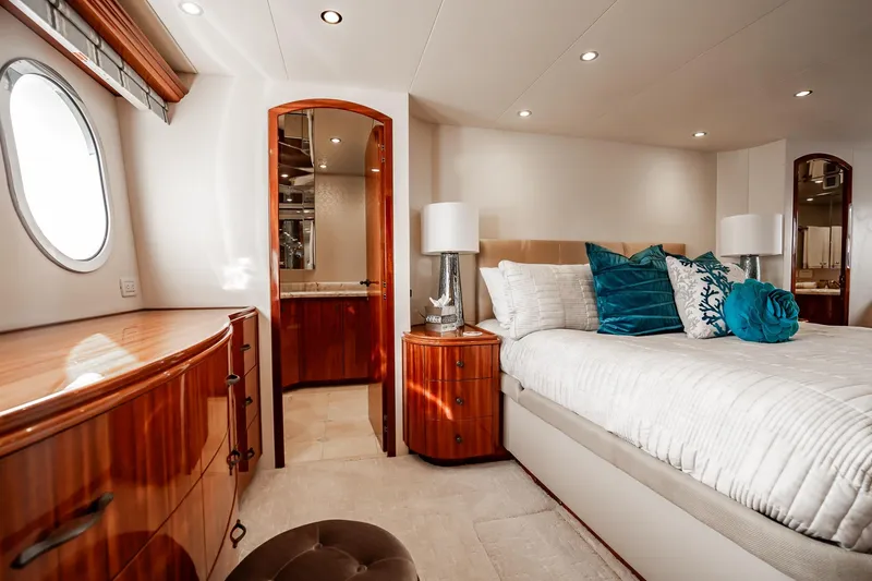 Slide: The Image of Luxurious bedroom interior of 2012 Hatteras 80 Motor Yacht with elegant wood finishes. - 110