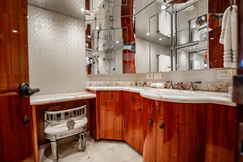 Slide: The Image of Luxurious bathroom interior on 2012 Hatteras 80 Motor Yacht with elegant wood cabinetry. - 126