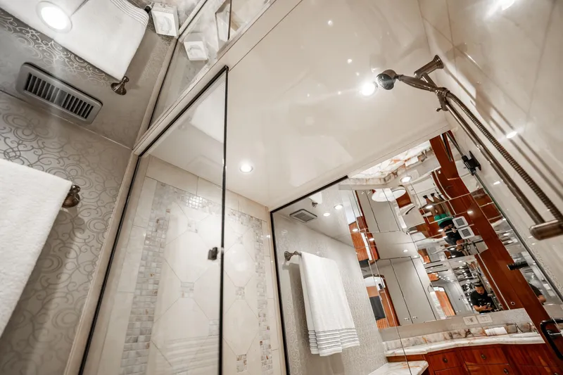 Slide: The Image of Luxurious bathroom interior of 2012 Hatteras 80 Motor Yacht with elegant fixtures and decor. - 130