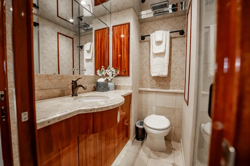 Slide: The Image of Luxurious bathroom in 2012 Hatteras 80 Motor Yacht with elegant wood and marble finishes. - 134