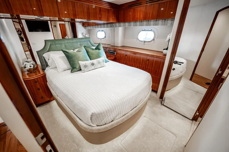 Slide: The Image of Luxurious bedroom interior of 2012 Hatteras 80 Motor Yacht with elegant wood finishes. - 136