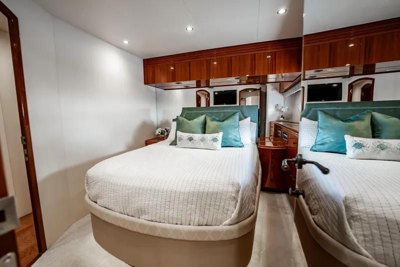 Slide: The Image of Luxurious bedroom interior of 2012 Hatteras 80 Motor Yacht with elegant bedding and wood accents. - 137