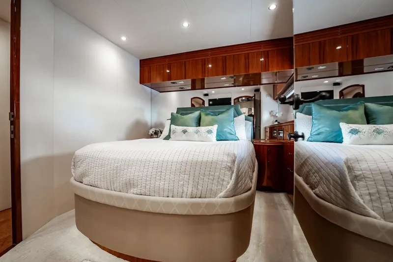 Slide: The Image of Luxurious bedroom interior of 2012 Hatteras 80 Motor Yacht with elegant bedding and wood accents. - 139