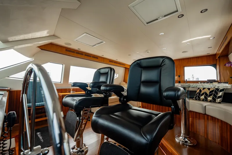 Slide: The Image of Luxurious interior of 2012 Hatteras 80 Motor Yacht with plush seating and elegant design. - 14