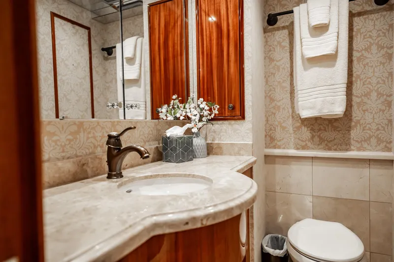 Slide: The Image of Luxurious bathroom on 2012 Hatteras 80 Motor Yacht with elegant fixtures and decor. - 141