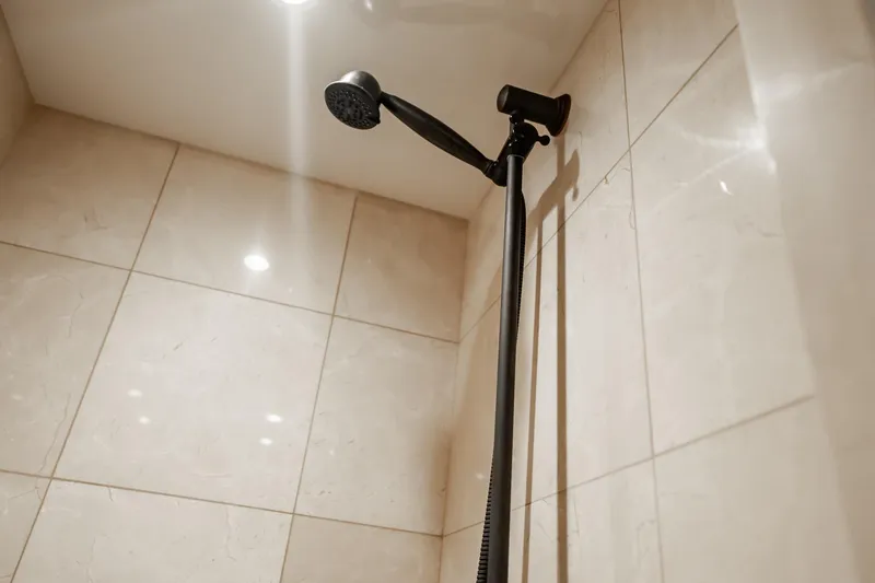 Slide: The Image of Showerhead in luxurious bathroom of 2012 Hatteras 80 Motor Yacht. - 142