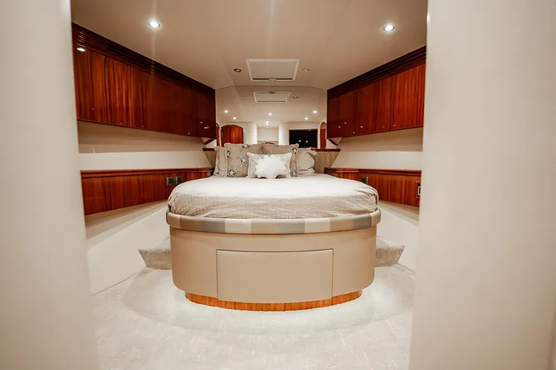 Slide: The Image of Luxurious bedroom interior of 2012 Hatteras 80 Motor Yacht with elegant wood finishes. - 151