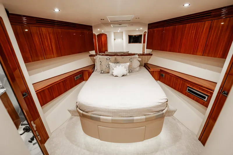 Slide: The Image of Luxurious bedroom interior of 2012 Hatteras 80 Motor Yacht with elegant wood finishes. - 153