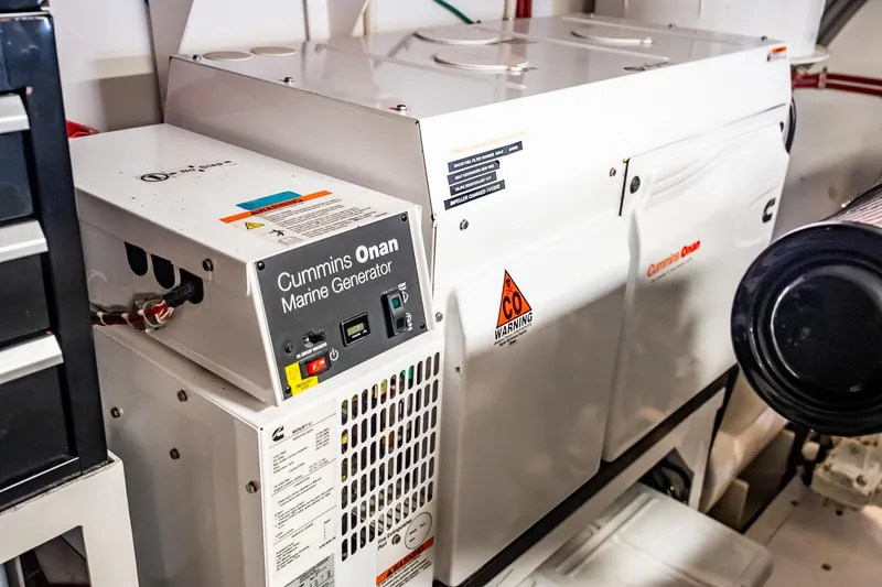 Slide: The Image of Cummins Onan marine generator in 2012 Hatteras 80 Motor Yacht engine room. - 165