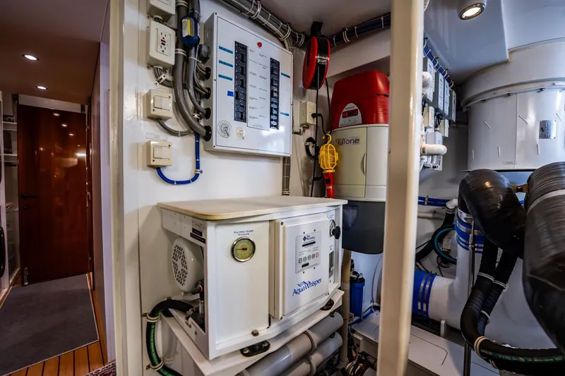 Slide: The Image of Engine room of 2012 Hatteras 80 Motor Yacht with control panels and equipment. - 166
