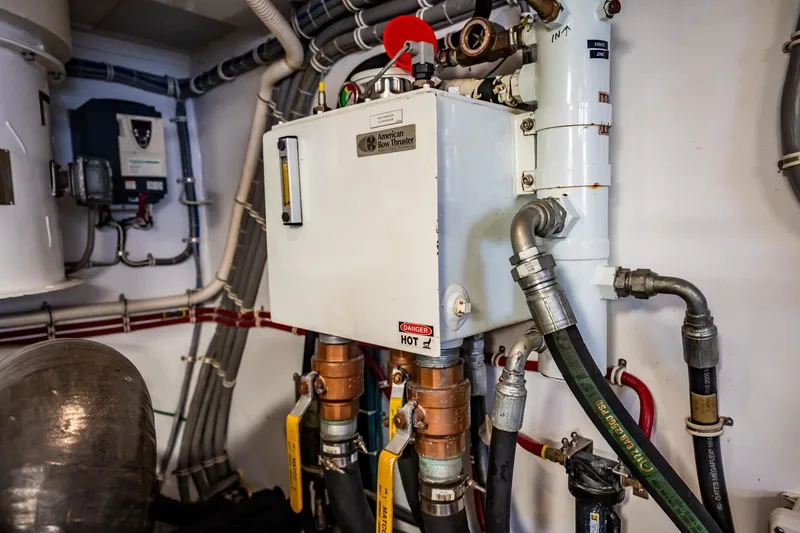 Slide: The Image of Engine room of 2012 Hatteras 80 Motor Yacht with mechanical equipment and piping. - 168