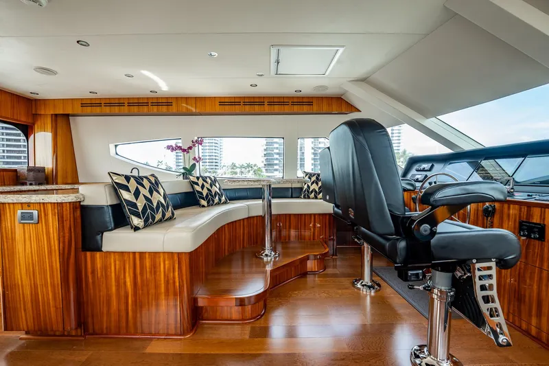 Slide: The Image of Luxurious interior of 2012 Hatteras 80 Motor Yacht with plush seating and modern helm. - 17