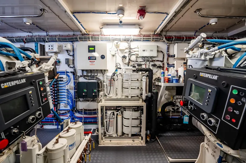 Slide: The Image of Engine room of 2012 Hatteras 80 Motor Yacht with Caterpillar machinery and control systems. - 174