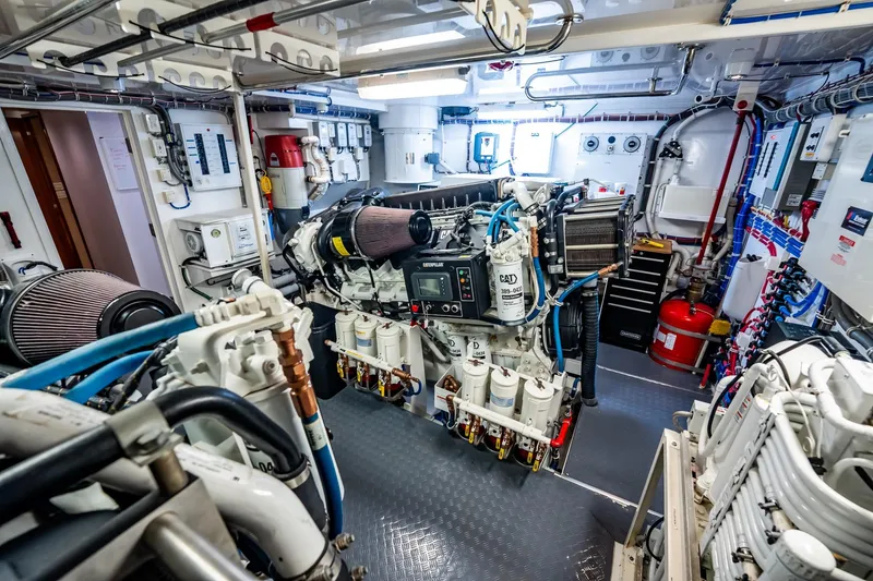 Slide: The Image of Engine room of a 2012 Hatteras 80 Motor Yacht, showcasing advanced machinery and equipment. - 175