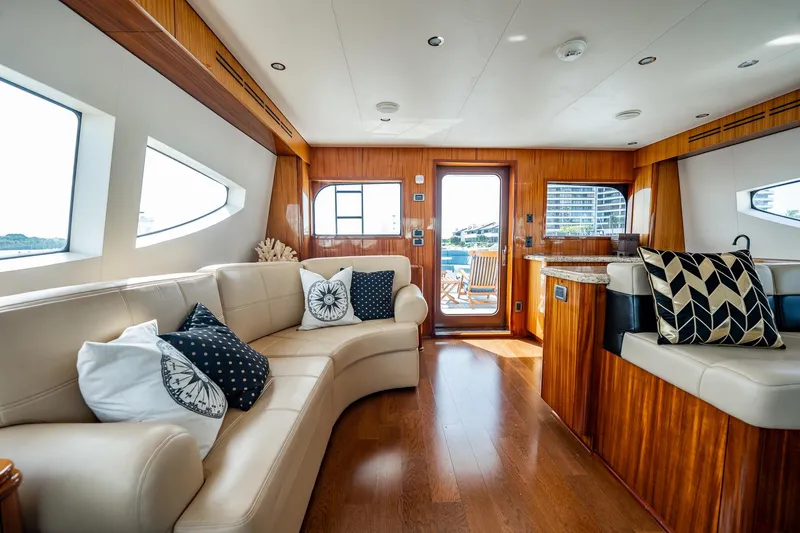 Slide: The Image of Luxurious interior of 2012 Hatteras 80 Motor Yacht with elegant seating and wooden accents. - 20