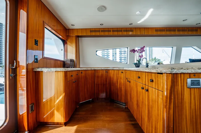 Slide: The Image of Luxurious wooden interior of 2012 Hatteras 80 Motor Yacht with granite countertops. - 27