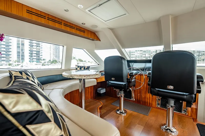 Slide: The Image of Luxurious interior of 2012 Hatteras 80 Motor Yacht with plush seating and modern helm. - 30
