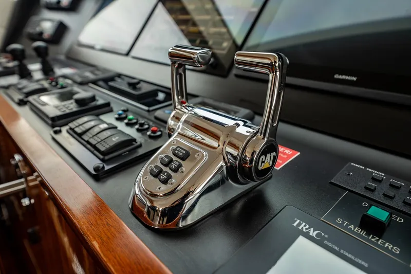 Slide: The Image of Control panel of 2012 Hatteras 80 Motor Yacht with CAT throttle lever. - 33