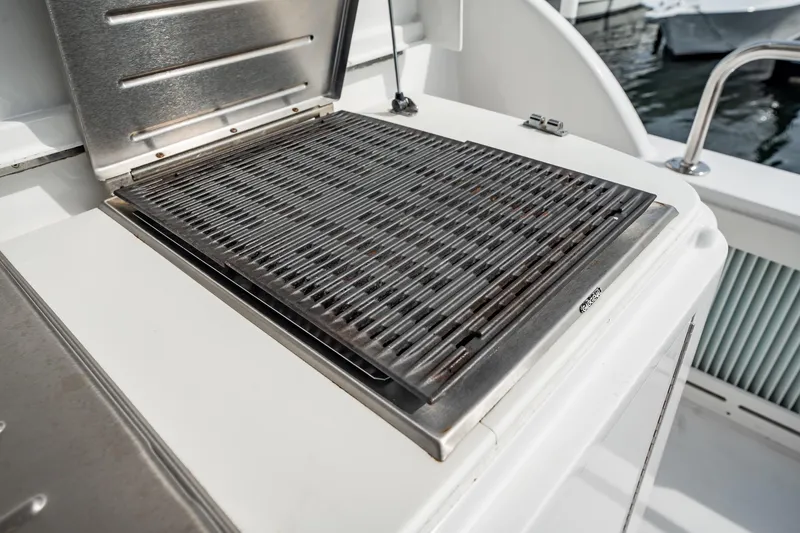 Slide: The Image of Outdoor grill on 2012 Hatteras 80 Motor Yacht deck, near marina. - 45