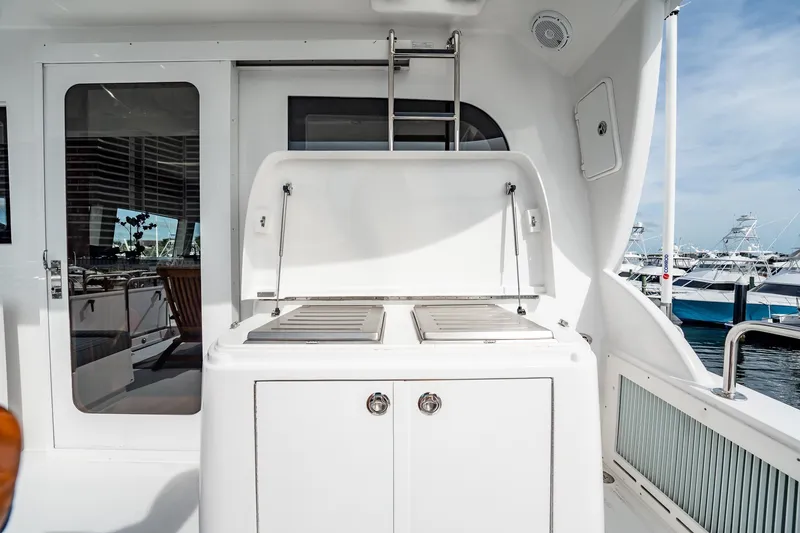 Slide: The Image of Outdoor grill area on 2012 Hatteras 80 Motor Yacht, docked at marina. - 47