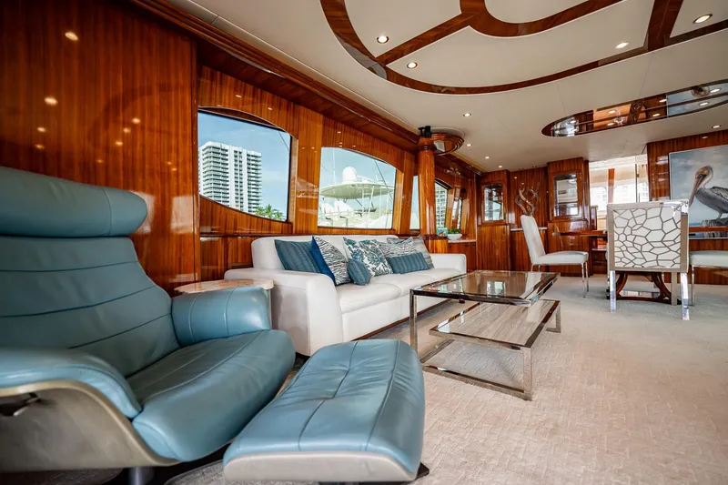 Slide: The Image of Luxurious interior of 2012 Hatteras 80 Motor Yacht with elegant seating and modern decor. - 54