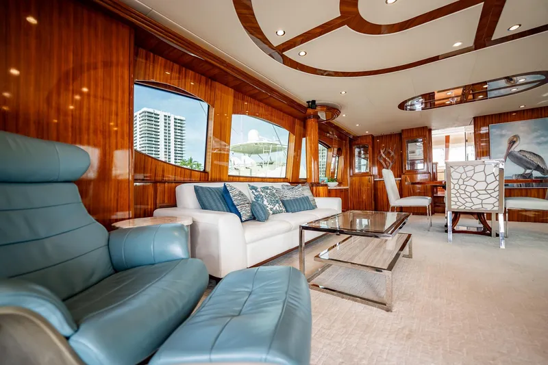 Slide: The Image of Luxurious interior of 2012 Hatteras 80 Motor Yacht with elegant seating and wooden accents. - 57