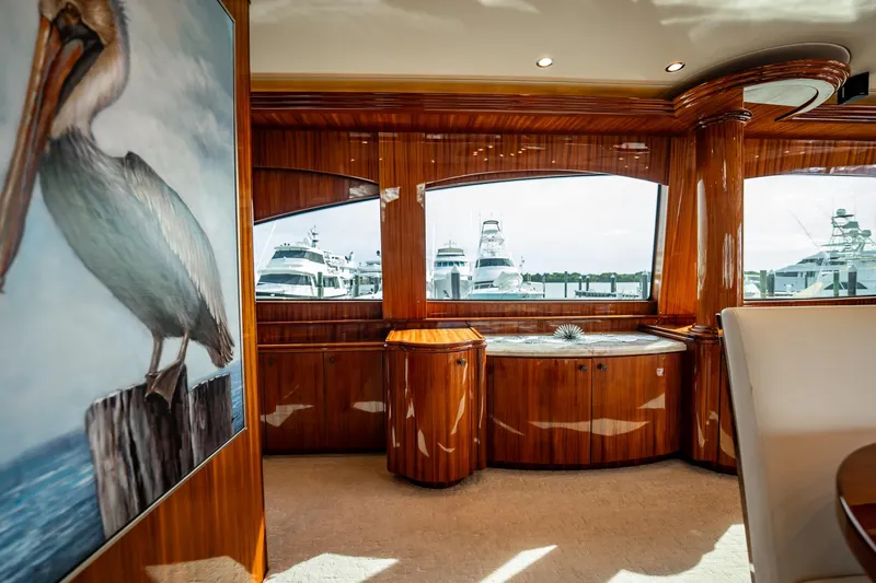 Slide: The Image of Luxurious interior of 2012 Hatteras 80 Motor Yacht with elegant wood finish and pelican artwork. - 59