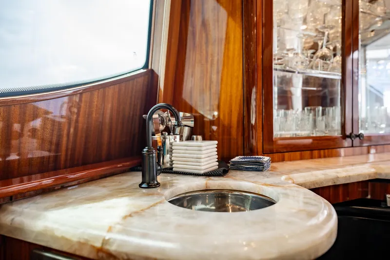 Slide: The Image of Luxurious interior of 2012 Hatteras 80 Motor Yacht with elegant sink and cabinetry. - 60
