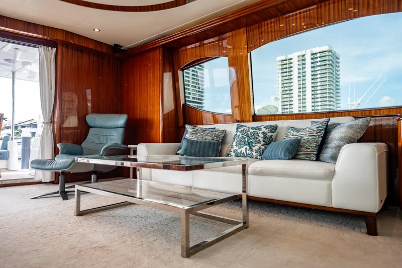 Slide: The Image of Luxurious interior of 2012 Hatteras 80 Motor Yacht with elegant seating and modern decor. - 65