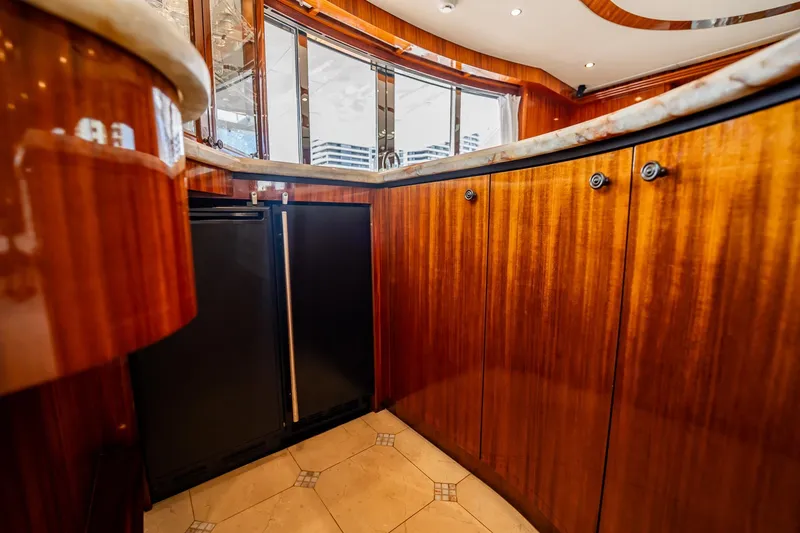 Slide: The Image of Luxurious wood cabinetry in 2012 Hatteras 80 Motor Yacht interior, featuring modern design elements. - 69
