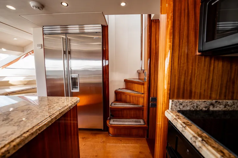Slide: The Image of Luxurious interior of 2012 Hatteras 80 Motor Yacht with elegant wood finishes and modern appliances. - 71