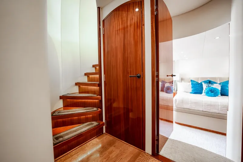 Slide: The Image of Luxurious interior of 2012 Hatteras 80 Motor Yacht with wooden stairs and elegant bedroom. - 72