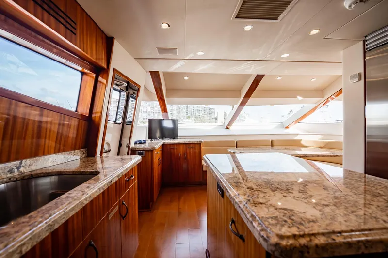 Slide: The Image of Luxurious interior of 2012 Hatteras 80 Motor Yacht with elegant wood and granite finishes. - 86