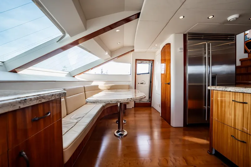 Slide: The Image of Luxurious interior of 2012 Hatteras 80 Motor Yacht with elegant wood finishes and modern design. - 87