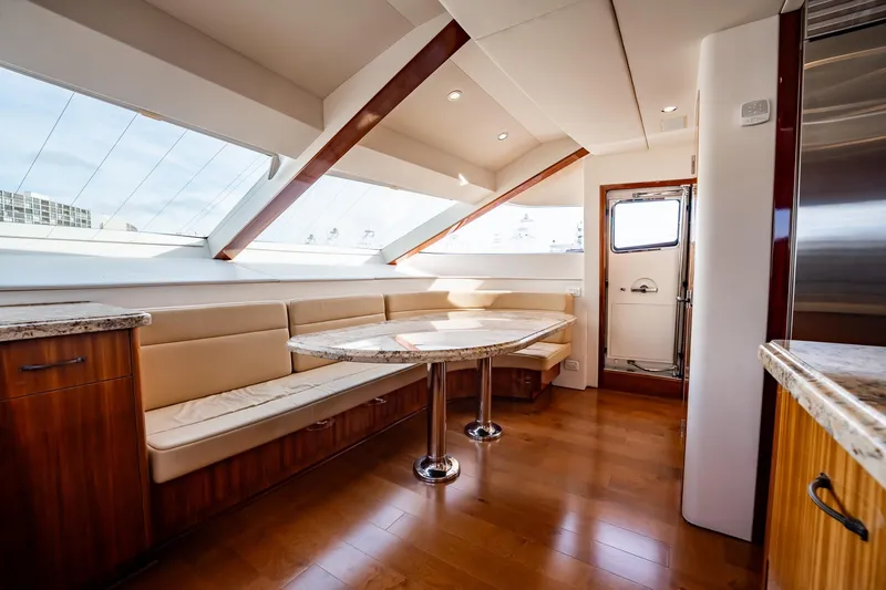 Slide: The Image of Luxurious interior of 2012 Hatteras 80 Motor Yacht with elegant seating and modern design. - 89