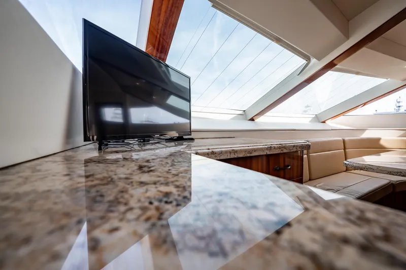 Slide: The Image of Luxurious interior of 2012 Hatteras 80 Motor Yacht with TV and skylight. - 90