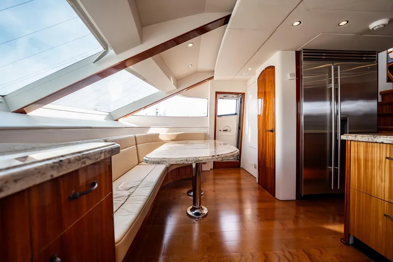 Slide: The Image of Luxurious interior of 2012 Hatteras 80 Motor Yacht with elegant wood finishes and modern design. - 97