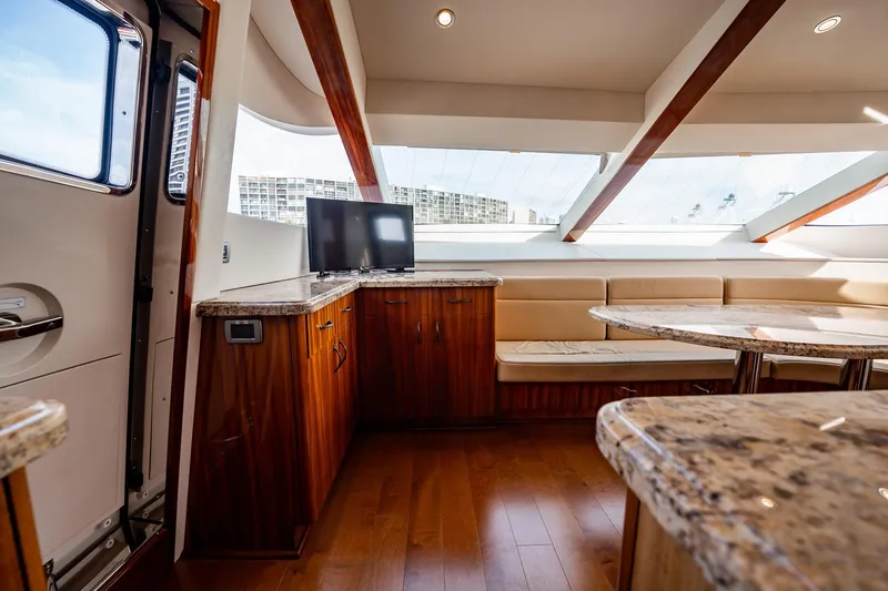 Slide: The Image of Luxurious interior of 2012 Hatteras 80 Motor Yacht with elegant wood and granite finishes. - 99