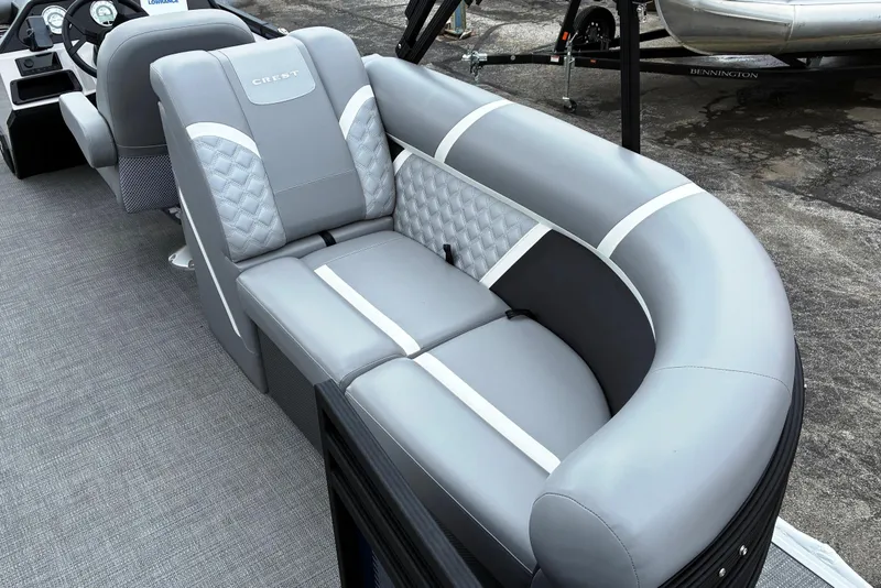 Slide: The Image of 2025 Crest CLASSIC 220 SLC boat interior with luxurious gray seating and modern design. - 12