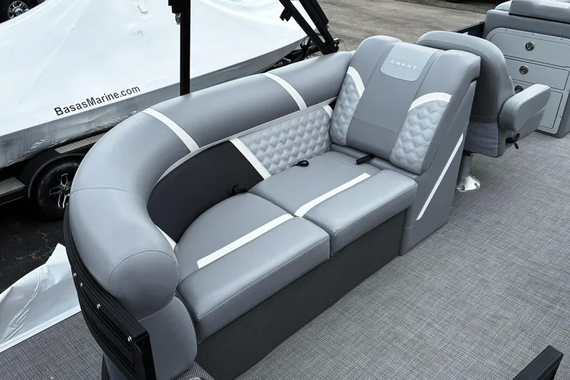 Slide: The Image of Luxurious seating on 2025 Crest CLASSIC 220 SLC pontoon boat, featuring elegant gray upholstery. - 13