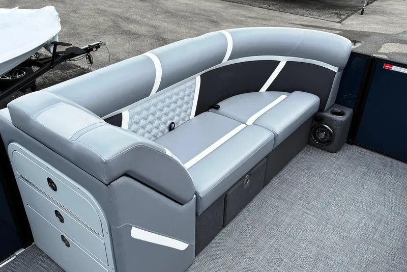 Slide: The Image of 2025 Crest CLASSIC 220 SLC boat interior with sleek gray seating and modern design. - 7