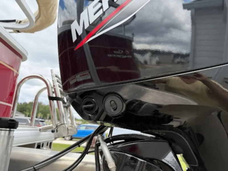 Slide: The Image of Close-up of a Mercury outboard motor on a 2024 Sun Tracker Party Barge. - 12