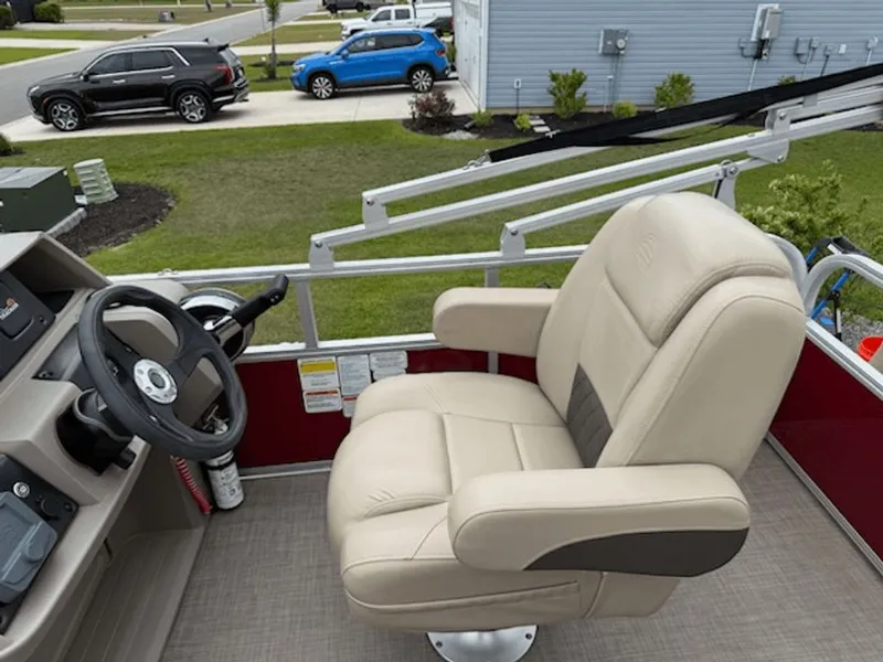 Slide: The Image of 2024 Sun Tracker PARTY BARGE helm with beige captain's chair. - 4