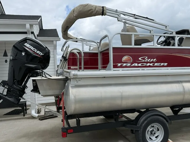 Slide: The Image of 2024 Sun Tracker PARTY BARGE with Mercury engine on trailer. - 9