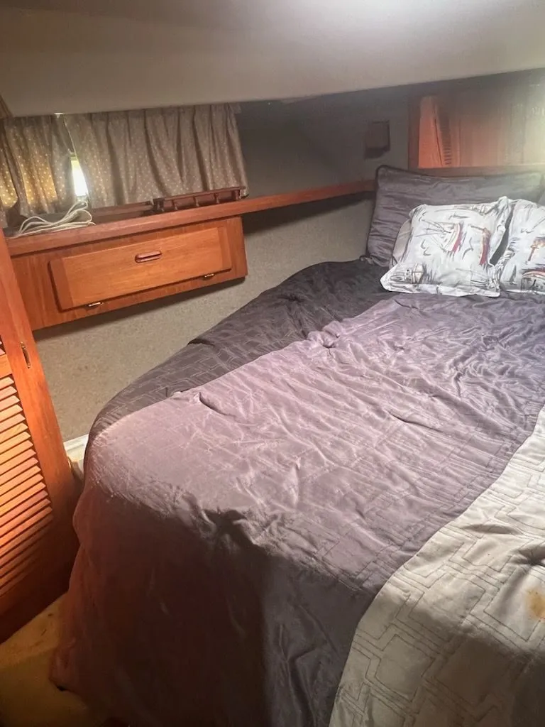 Slide: The Image of Interior of 1986 Tiara Yachts 36 Express with cozy bed. - 2