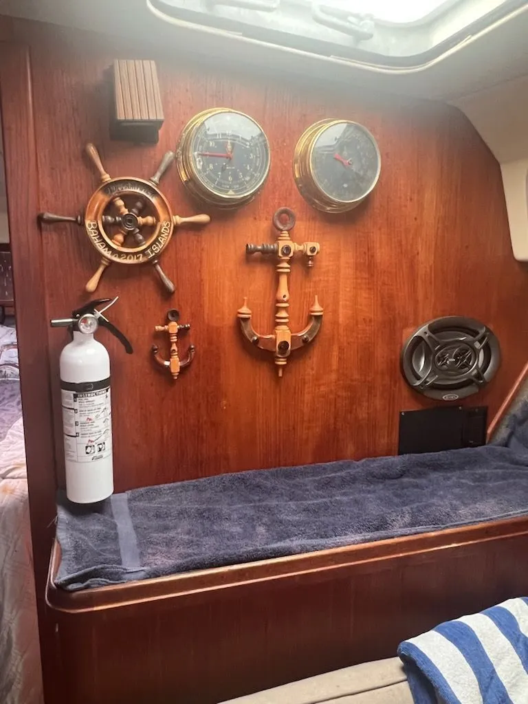 Slide: The Image of Interior of a 1986 Tiara Yachts 36 Express with nautical decor. - 3