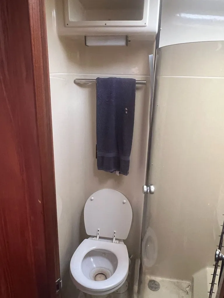 Slide: The Image of Tiara Yachts 36 Express 1986 bathroom with toilet and towel. - 5